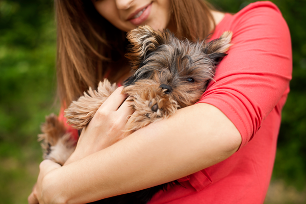 Woman holding dog